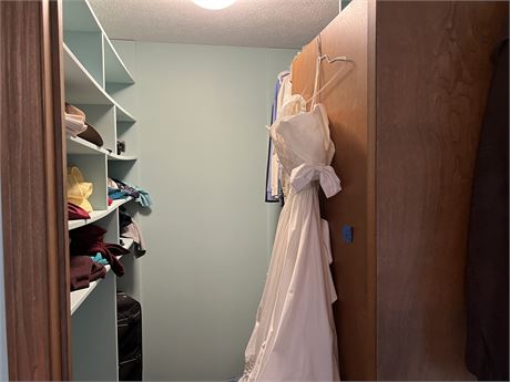 Master bedroom closet clean out includes men's and women's clothes, wedding dres