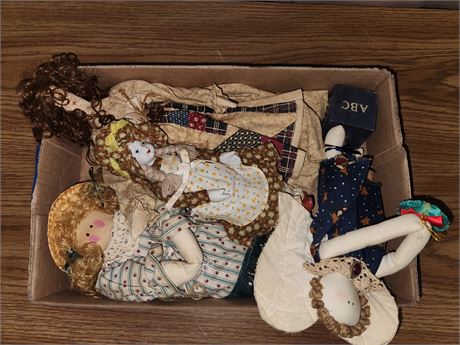 4 dolls.1 porcelain. 1 wood. 2 cloth