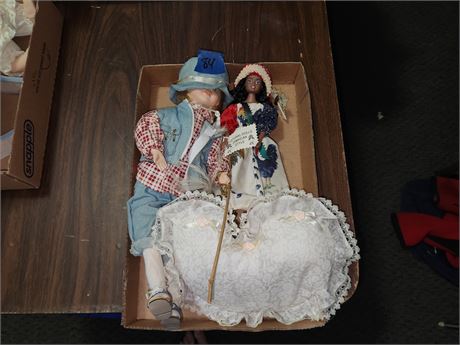 One Porcelain Doll, and one Rubber Cultural Doll
