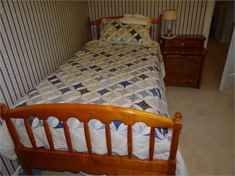 Twin Bed and Nightstand with Blue Quilt
