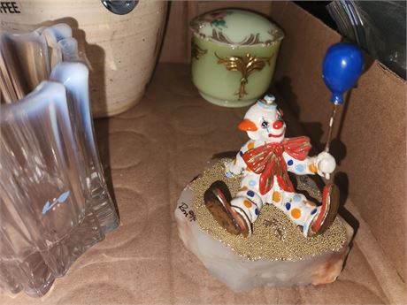 Clown Sitting On A Piece Of Slag Glass