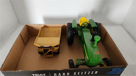 John Deere Tractor and Caterpillar dump truck