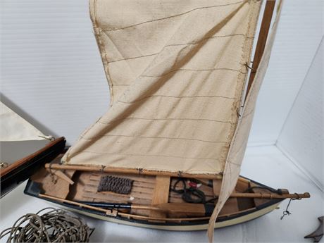 2 wooden sailboats