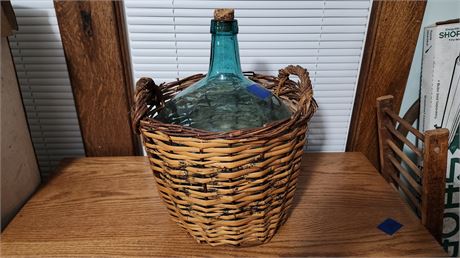 Glass jug in wicker Basket