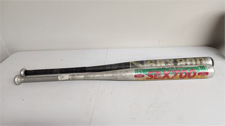 2 Bats. One Says Softball Bat On It