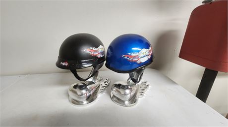 2 Motorcycle Helmets On Display stands