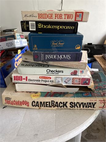 Stack of vintage toys and games