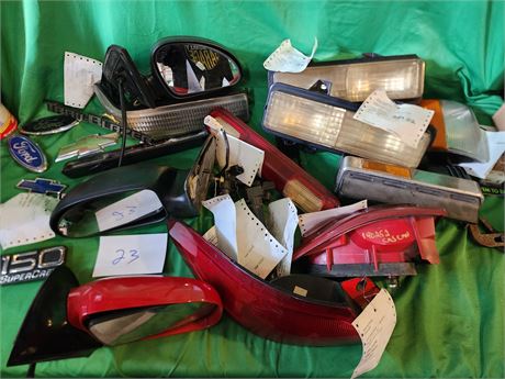 Used car parts with tags with cars they fit