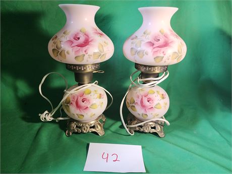 pair of hurricane lamps