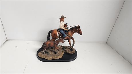 Cowgirl Riding A Horse Statue