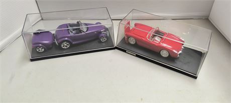 2 Collectible Model Cars In Display Cases