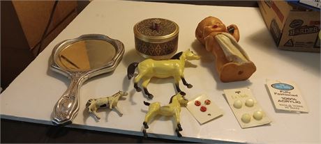 Toy horses, buttons, mirror