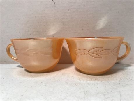 2 Fire King Oven Ware Peach Lustre Teacups