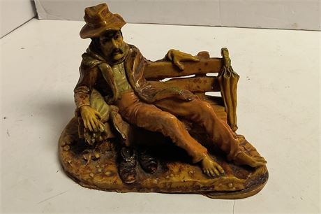 Vintage Cowboy On A bench Statue