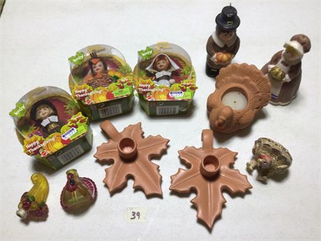 Thanksgiving collectable dolls, festive candle holders, candles, and turkeys