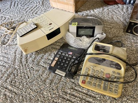 Clock, Calculators, Bose (Not Sure if Works, Static Noise)